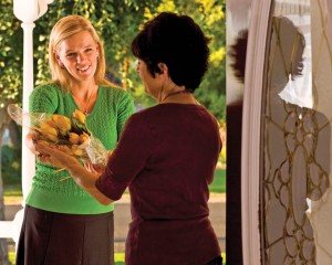 A Mormon Woman Gives Flowers to a Friend